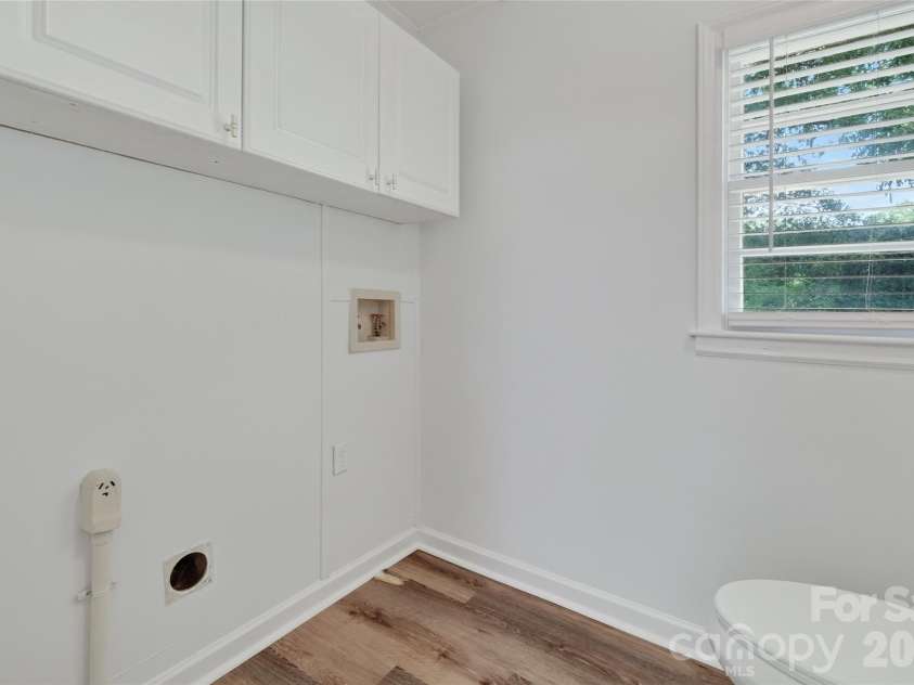 1062 Dresden Drive, Charlotte, NC 28205.  MLS# CAR4412052, YatesRealty ID 45694. Laundry Space located in Half Bath off Kitchen