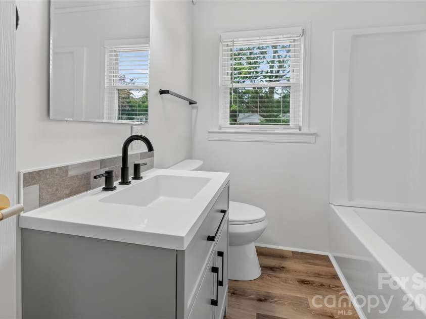 1062 Dresden Drive, Charlotte, NC 28205.  MLS# CAR4412052, YatesRealty ID 45694. Updated Hall Bathroom