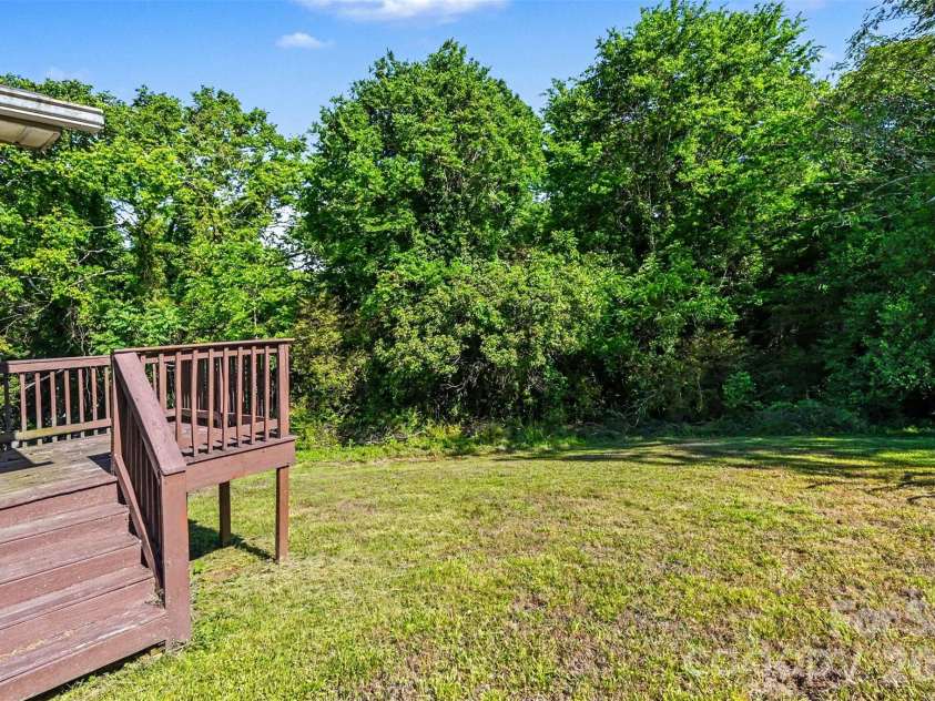 1025 Martin Luther King Jr Drive, Albemarle, NC 28001.  MLS# CAR4380740, YatesRealty ID 457. Backyard and deck