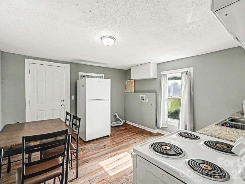 1025 Martin Luther King Jr Drive, Albemarle, NC 28001.  MLS# CAR4380740, YatesRealty ID 457. Kitchen and dining area
