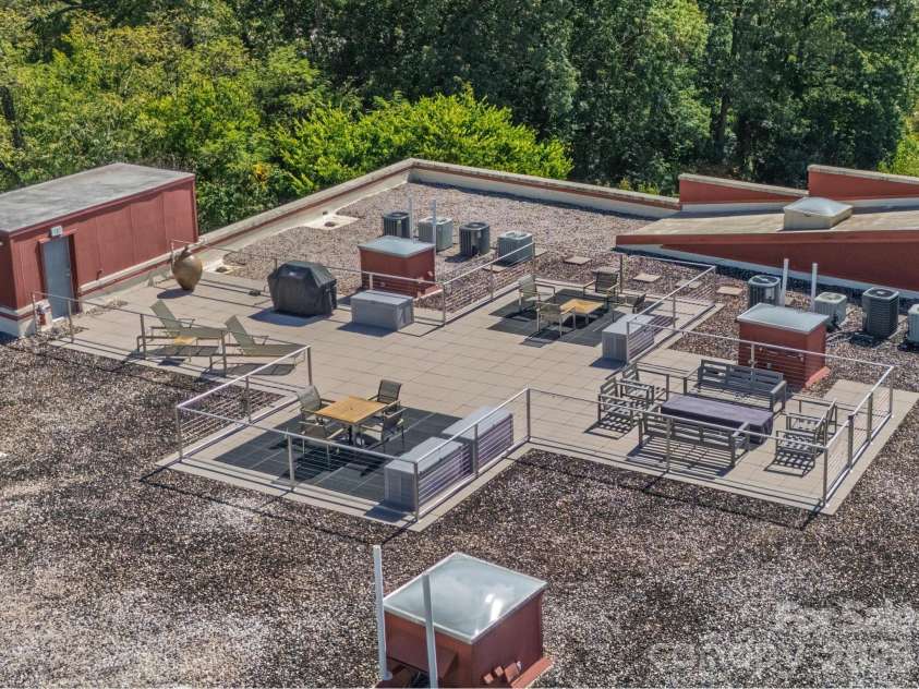 100 Coxe Avenue, Asheville, NC 28801.  MLS# CAR4307768, YatesRealty ID 4570. Spacious rooftop deck offering sweeping views day and night