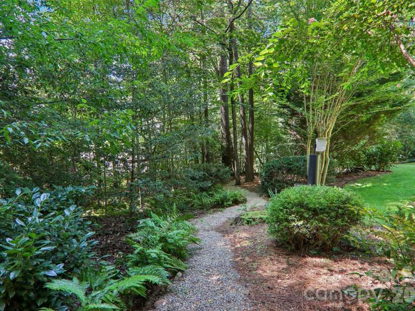133 Larchmont Drive, Hendersonville, NC 28791.  MLS# CAR4415855, YatesRealty ID 45708. Backyard path
