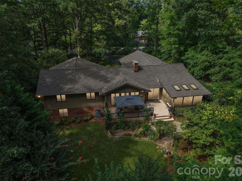 133 Larchmont Drive, Hendersonville, NC 28791.  MLS# CAR4415855, YatesRealty ID 45708. Night view of rear