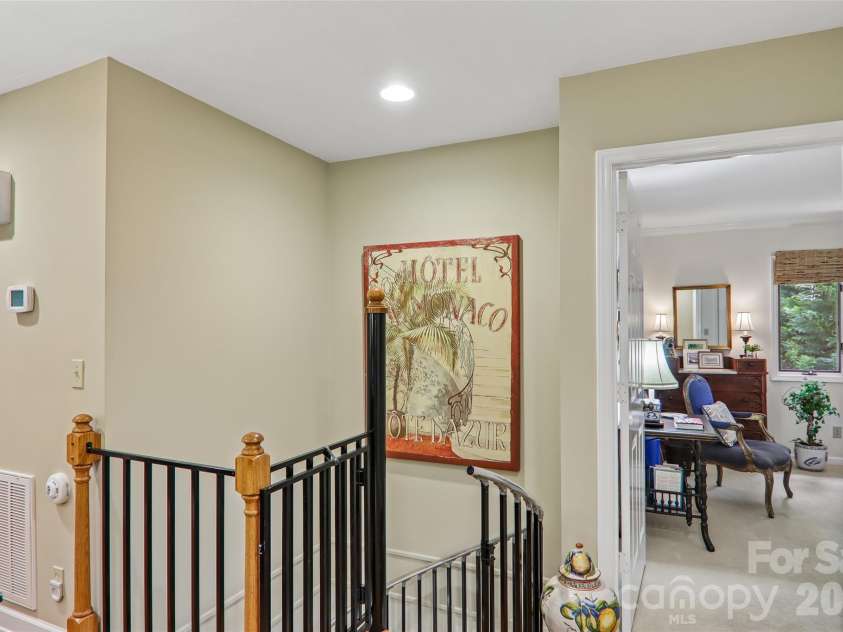 133 Larchmont Drive, Hendersonville, NC 28791.  MLS# CAR4415855, YatesRealty ID 45708. Spiral stairs to lower level
