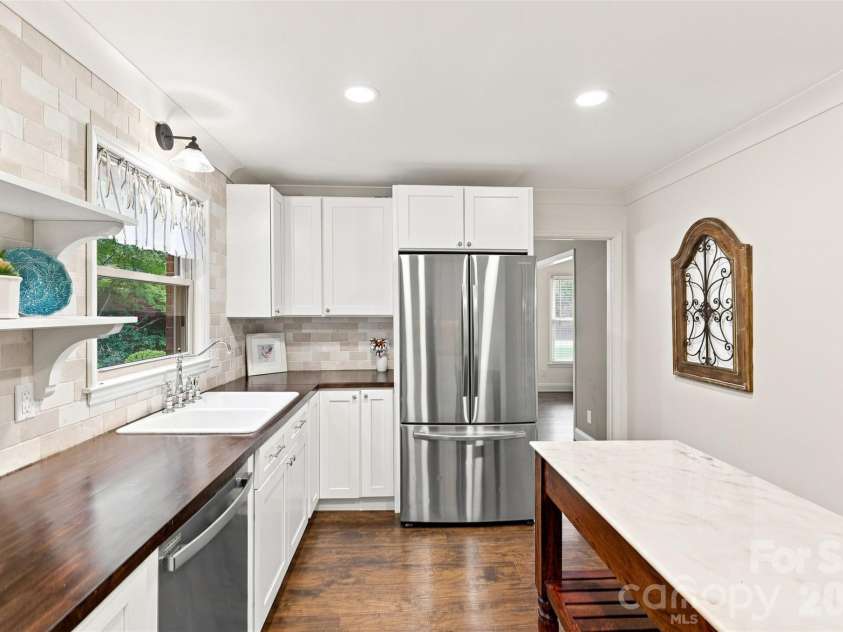 1002 Leewood Drive, Monroe, NC 28112.  MLS# CAR4416687, YatesRealty ID 45719. Butcher block countertops add to the rustic charm
