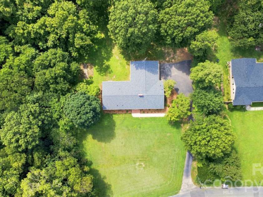 1002 Leewood Drive, Monroe, NC 28112.  MLS# CAR4416687, YatesRealty ID 45719. Drone image show cases a brand new roof!