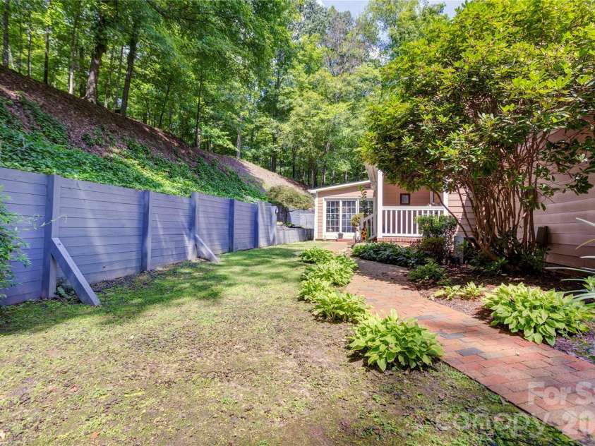 129 Overbrook Drive, Concord, NC 28025.  MLS# CAR4416139, YatesRealty ID 45731. Backyard walkway