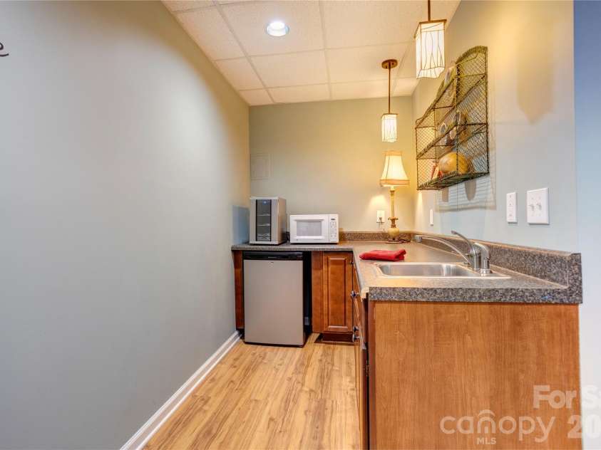 129 Overbrook Drive, Concord, NC 28025.  MLS# CAR4416139, YatesRealty ID 45731. Basement kitchen
