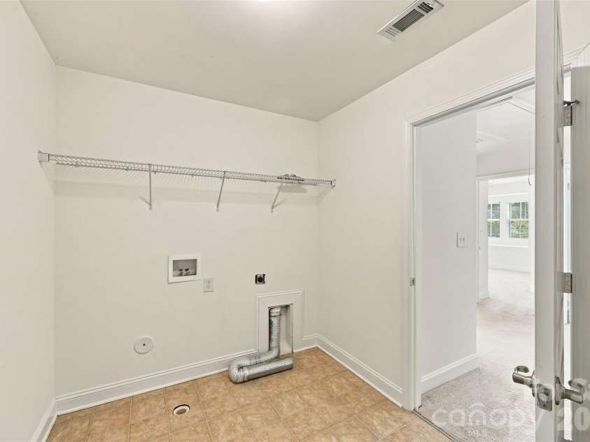 15614 Normans Landing Drive, Charlotte, NC 28273.  MLS# CAR4416333, YatesRealty ID 45741. Generously sized second floor laundry room.