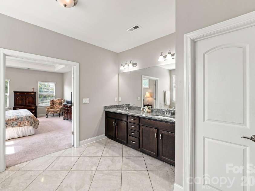 5009 Lydgate Drive, Waxhaw, NC 28173.  MLS# CAR4415096, YatesRealty ID 45758. Dual vanities with granite countertop