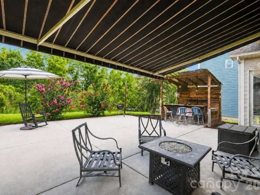 5009 Lydgate Drive, Waxhaw, NC 28173.  MLS# CAR4415096, YatesRealty ID 45758. Patio features, extendable awning for shade and sunny afternoons