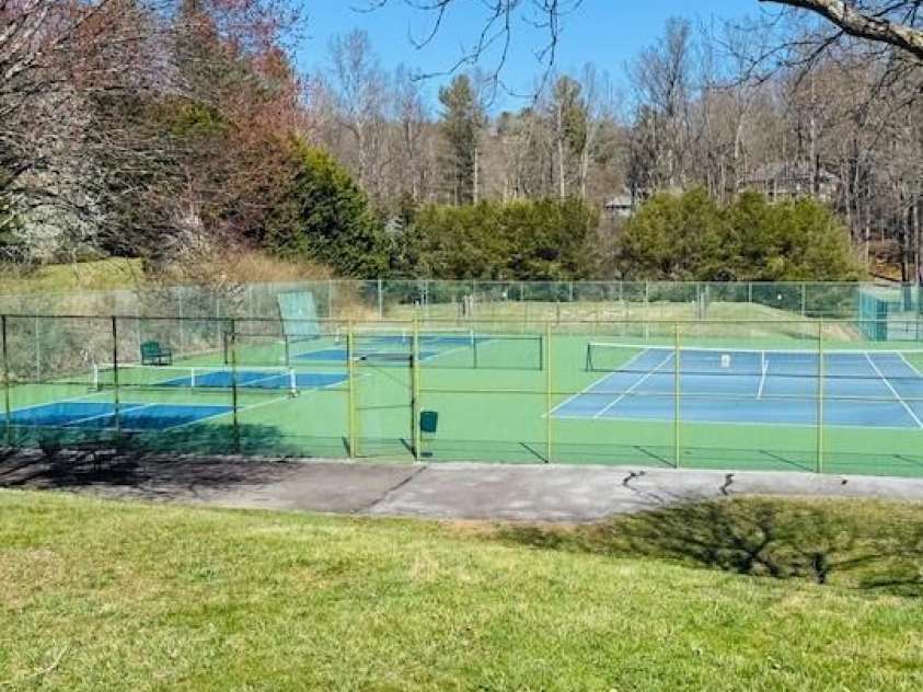121 Burning Tree Lane, Flat Rock, NC 28731.  MLS# CAR4352106, YatesRealty ID 4576. PICKLE BALL AND TENNIS COURTS