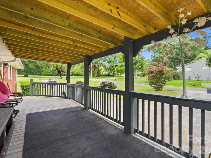 148 Era Street, Troutman, NC 28166.  MLS# CAR4409188, YatesRealty ID 45767. Wonderful large covered deck.