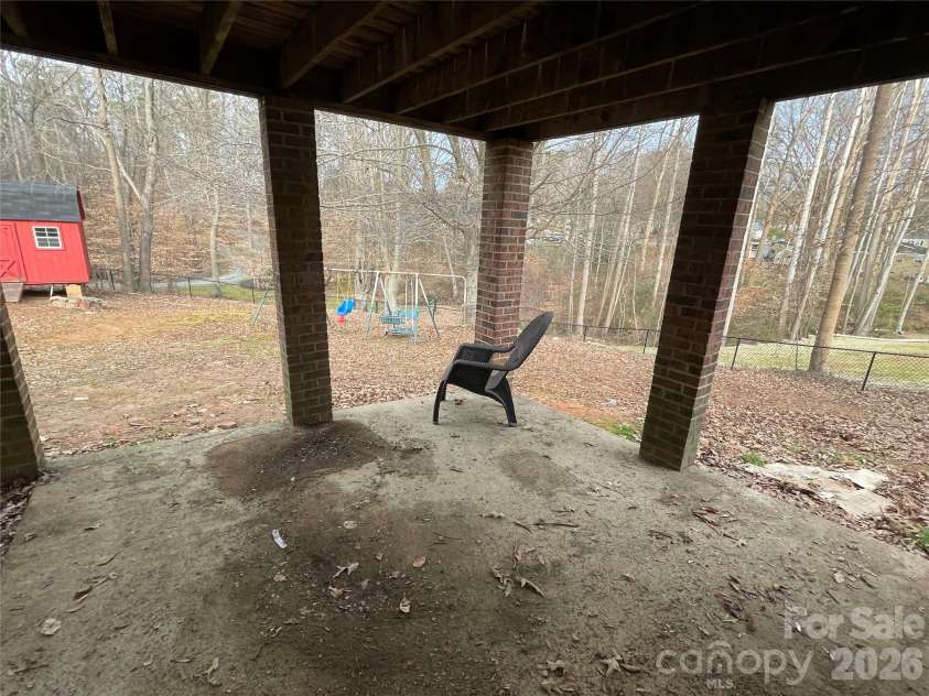 138 Walking Horse Run, Stanley, NC 28164.  MLS# CAR4345885, YatesRealty ID 4578. Patio under deck 