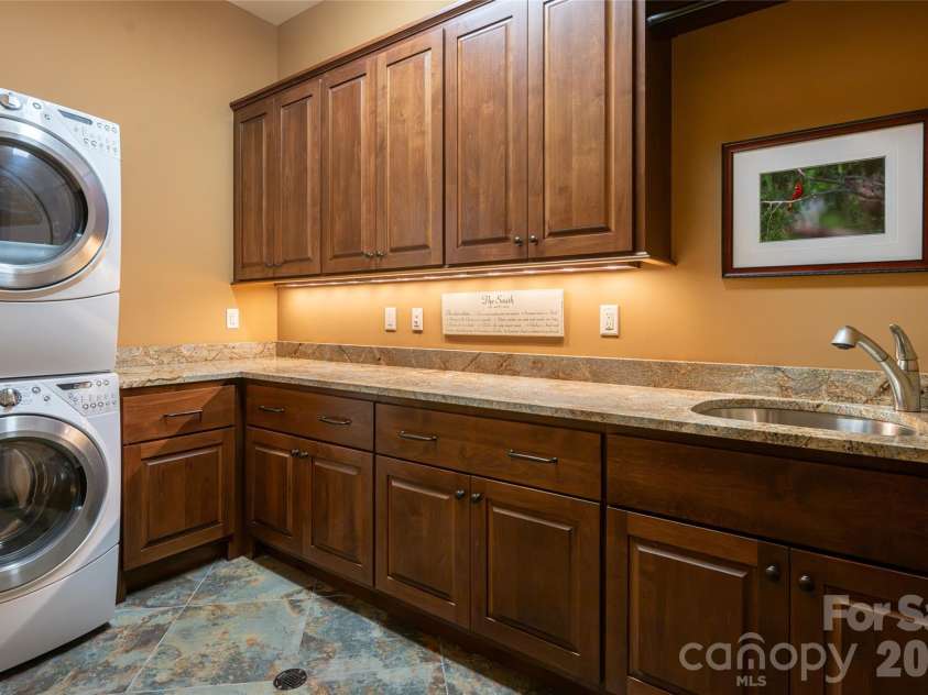 383 Eagle Ridge Road, Zirconia, NC 28790.  MLS# CAR4414334, YatesRealty ID 45781. Lower Level Laundry Room