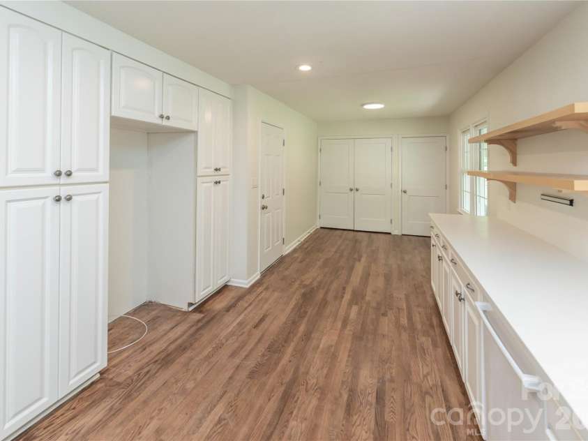 171 Suburban Avenue, Concord, NC 28025.  MLS# CAR4405894, YatesRealty ID 45797. Fridge nook with pull out shelving and storage system surrounding