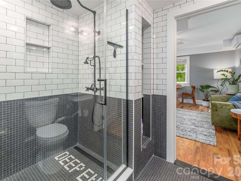 6 Birch Street, Asheville, NC 28801.  MLS# CAR4413466, YatesRealty ID 45798. Custom Tile Shower in lower level Primary Bath