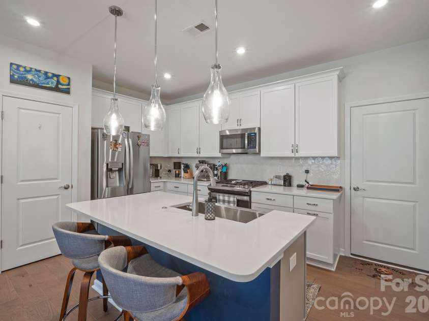 6161 Pierce Lane, Kannapolis, NC 28081.  MLS# CAR4416760, YatesRealty ID 45804. Kitchen with quartz and tile backsplash