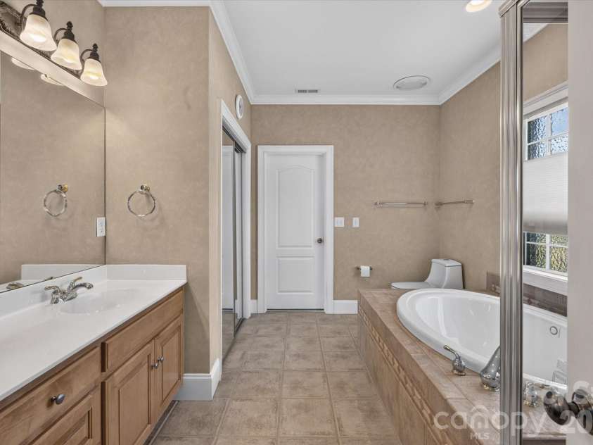 1913 Windmere Drive, Monroe, NC 28110.  MLS# CAR4416282, YatesRealty ID 45805. Primary Bath