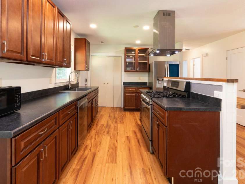 1009 Sharon Ridge Road, Fairview, NC 28730.  MLS# CAR4416738, YatesRealty ID 45809. Kitchen with breakfast bar.