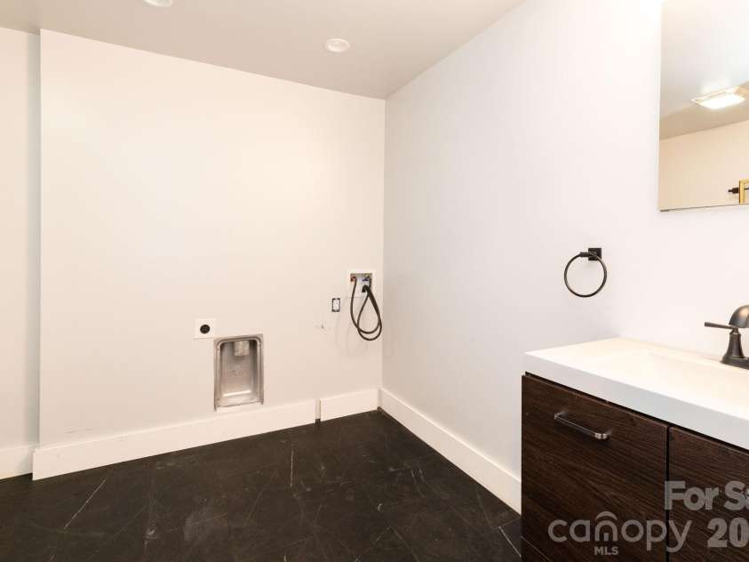 1009 Sharon Ridge Road, Fairview, NC 28730.  MLS# CAR4416738, YatesRealty ID 45809. Lower level bath.