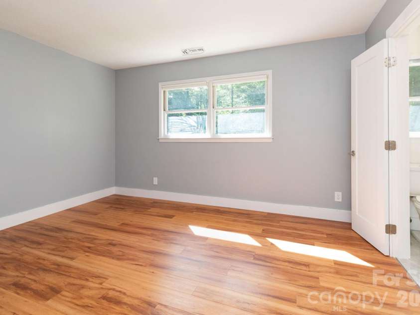 1009 Sharon Ridge Road, Fairview, NC 28730.  MLS# CAR4416738, YatesRealty ID 45809. Main level bedroom.