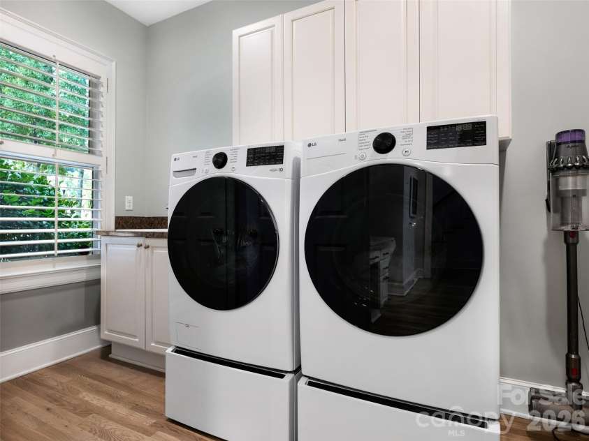 5216 Sunningdale Drive, Charlotte, NC 28277.  MLS# CAR4416178, YatesRealty ID 45821. Laundry, pantry, sink and extra closet off of kitchen