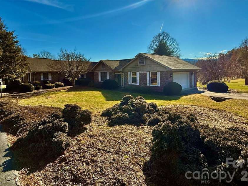 2001 Plum Tree Lane, Hendersonville, NC 28739.  MLS# CAR4333550, YatesRealty ID 4583. Front of the home from Circle driveway