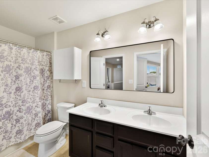 6911 Marissa Lane, Charlotte, NC 28212.  MLS# CAR4415275, YatesRealty ID 45855. Upstairs bathroom