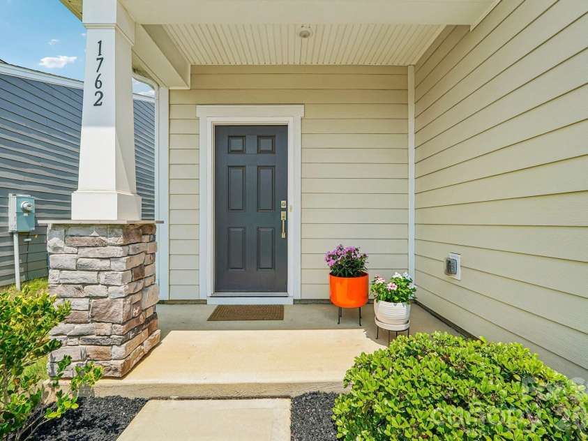 1762 Otter Perch Lane, Fort Mill, SC 29715.  MLS# CAR4414576, YatesRealty ID 45870. Front covered porch