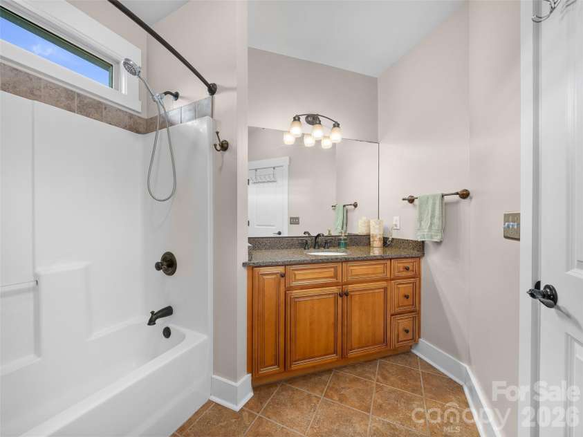 6 Oak Springs Drive, Arden, NC 28704.  MLS# CAR4414524, YatesRealty ID 45873. Guest bathroom