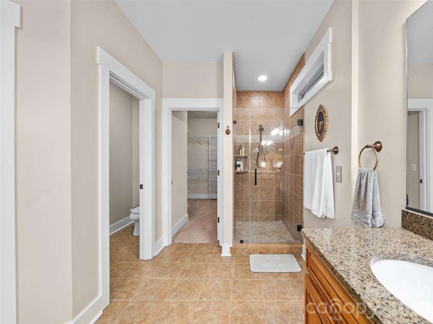 6 Oak Springs Drive, Arden, NC 28704.  MLS# CAR4414524, YatesRealty ID 45873. Primary bathroom