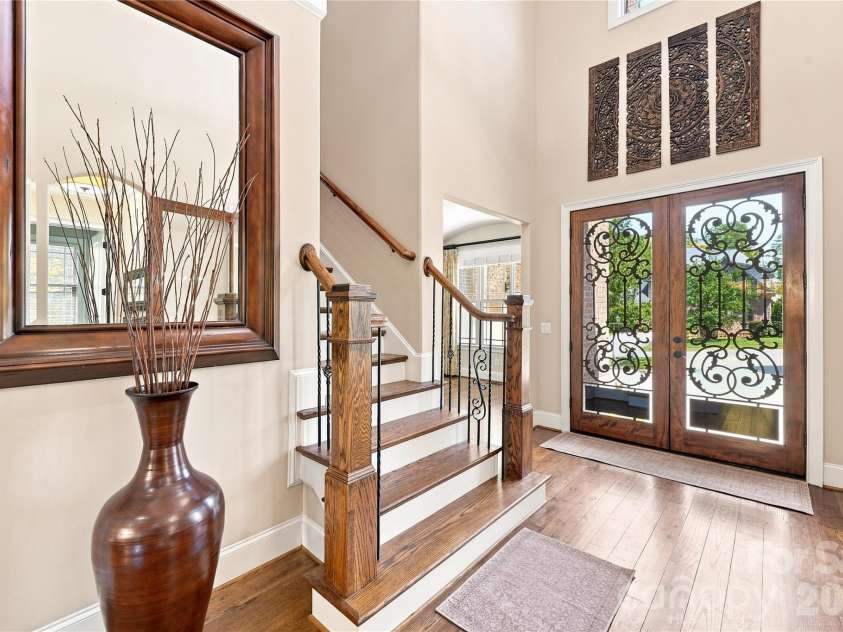 2455 Shiny Leaf Drive, Denver, NC 28037.  MLS# CAR4414414, YatesRealty ID 45874. Gorgeous 2-story entry with custom glass and wrought iron doors.