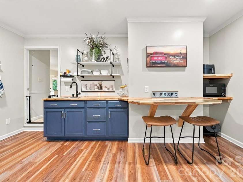 3933 MATTINGLY Drive, Hickory, NC 28602.  MLS# CAR4414536, YatesRealty ID 45875. ADU DONE BEAUTIFULLY. BUTCHER BLOCK COUNTERS WITH SHELF TABLE FOR MORNING COFFEE AND CHATS!
