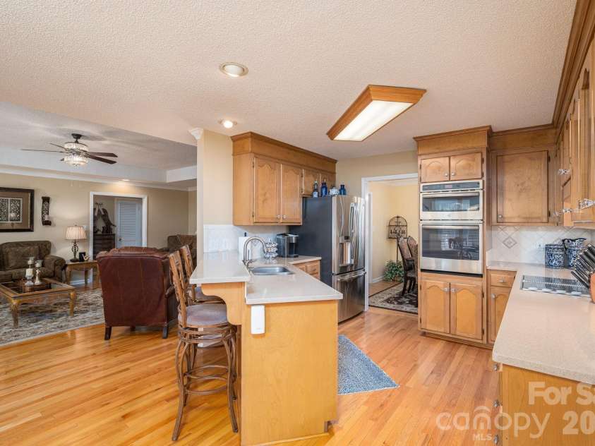 2928 Palmer Drive, Conover, NC 28613.  MLS# CAR4414179, YatesRealty ID 45881. Kitchen and Living Room