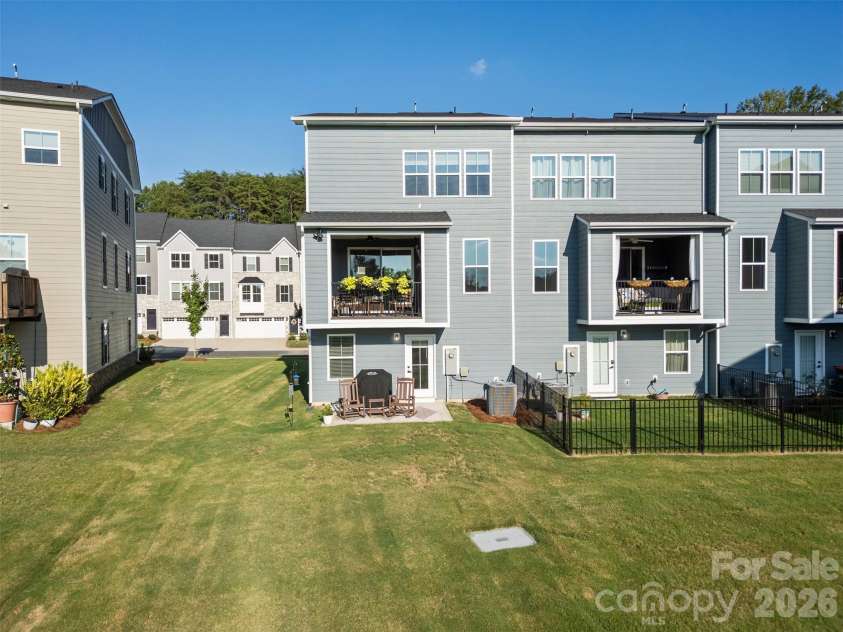 2035 Dornoch Road, Tega Cay, SC 29708.  MLS# CAR4412900, YatesRealty ID 45896. Expansive green space behind the home