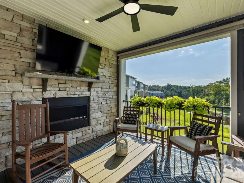 2035 Dornoch Road, Tega Cay, SC 29708.  MLS# CAR4412900, YatesRealty ID 45896. Fireplace and Tega Cay fireworks view