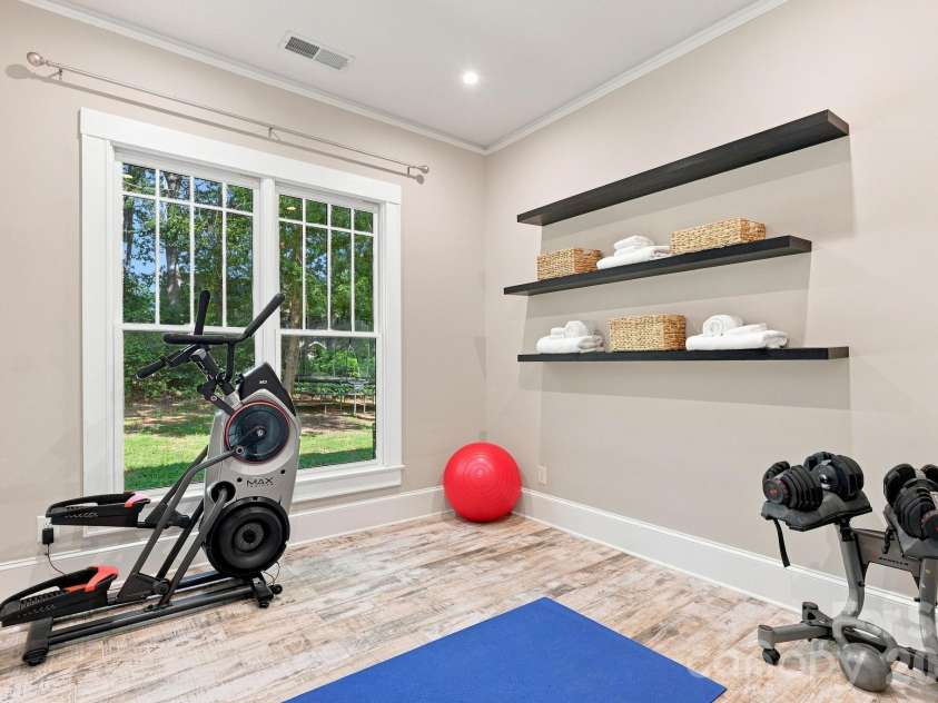 559 Main Street, Davidson, NC 28036.  MLS# CAR4412732, YatesRealty ID 45899. Guest Cottage Bedroom currently used as a gym