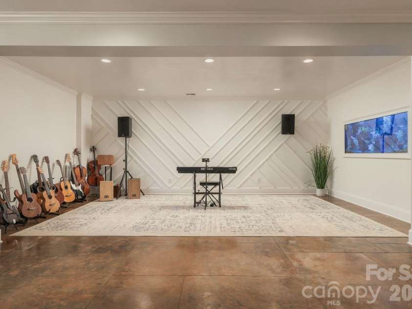 7275 Flowes Store Road, Concord, NC 28025.  MLS# CAR4429862, YatesRealty ID 45900. Bonus basement space features fish aquarium