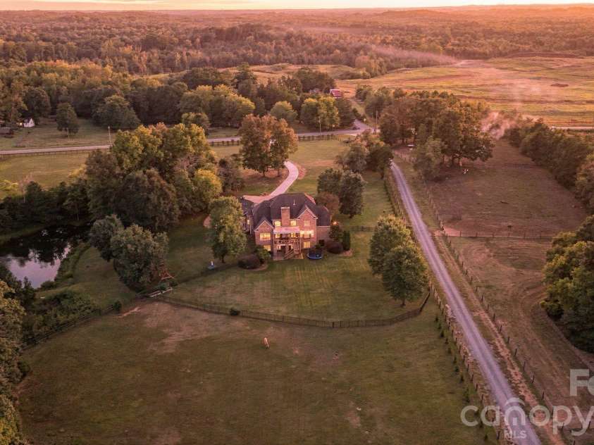 7275 Flowes Store Road, Concord, NC 28025.  MLS# CAR4429862, YatesRealty ID 45900. Enjoy the private setting and the sunset glow