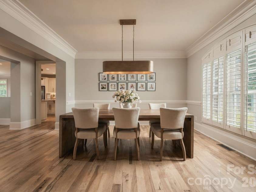 7275 Flowes Store Road, Concord, NC 28025.  MLS# CAR4429862, YatesRealty ID 45900. Formal dining complemented by natural wood floors