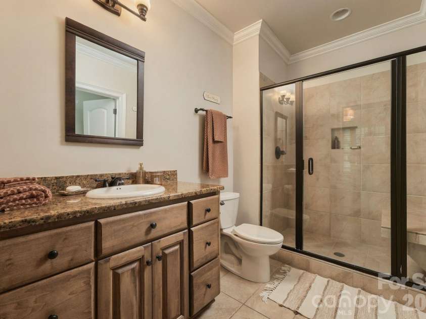 7275 Flowes Store Road, Concord, NC 28025.  MLS# CAR4429862, YatesRealty ID 45900. Full basement bathroom with walk-in tile shower