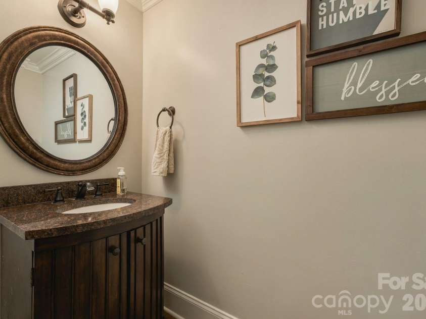 7275 Flowes Store Road, Concord, NC 28025.  MLS# CAR4429862, YatesRealty ID 45900. Main level half bath