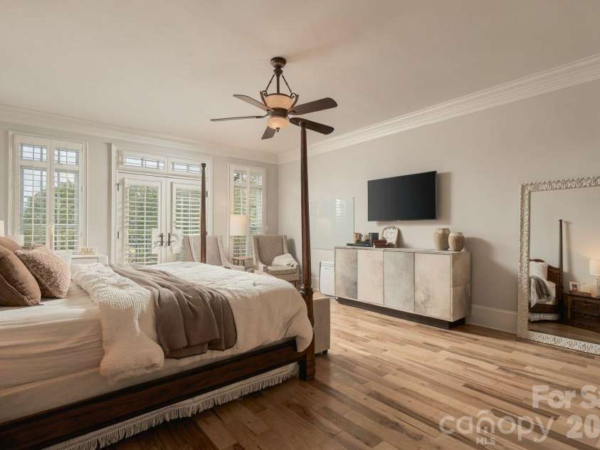 7275 Flowes Store Road, Concord, NC 28025.  MLS# CAR4429862, YatesRealty ID 45900. Spacious main level primary bedroom with private balcony