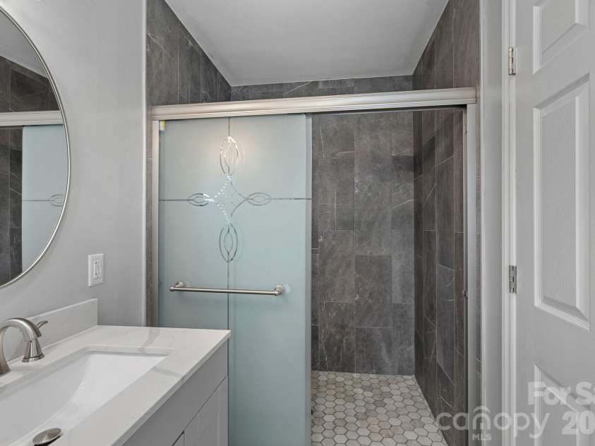 2561 Lumina Avenue, Charlotte, NC 28208.  MLS# CAR4412298, YatesRealty ID 45902. Primary Bathroom Shower