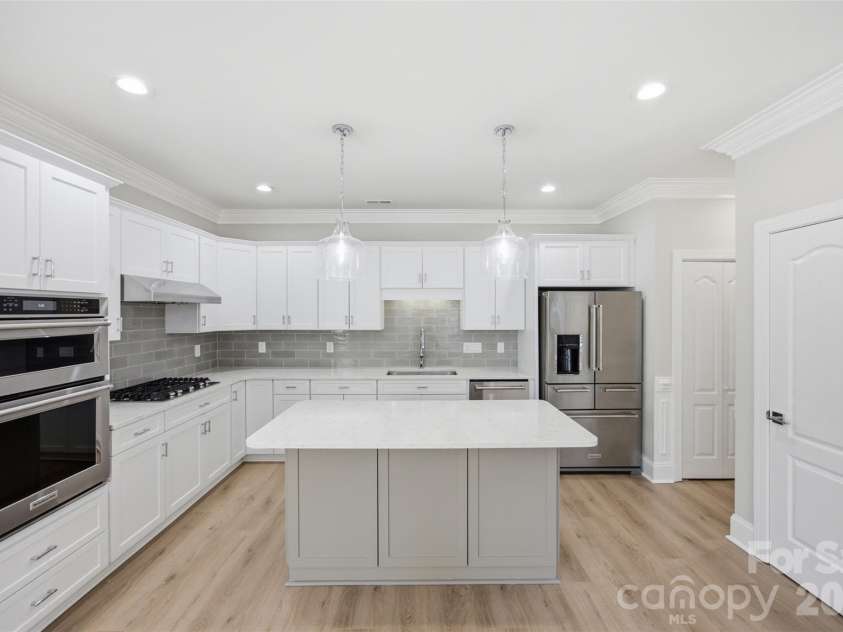 133 Harper Lee Street, Davidson, NC 28036.  MLS# CAR4412095, YatesRealty ID 45903. All new lighting over the island