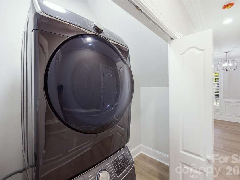 133 Harper Lee Street, Davidson, NC 28036.  MLS# CAR4412095, YatesRealty ID 45903. Large Laundry Area in hallway near primary.