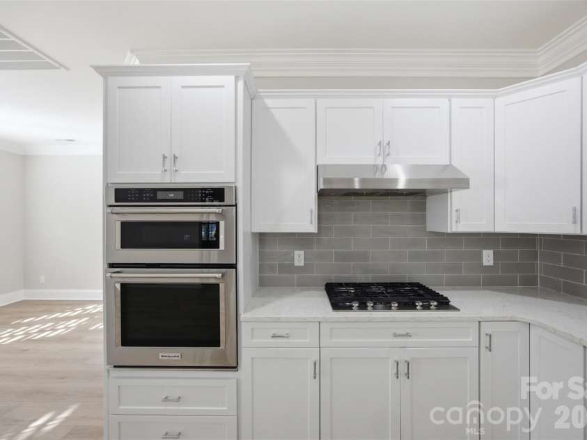 133 Harper Lee Street, Davidson, NC 28036.  MLS# CAR4412095, YatesRealty ID 45903. Stacked Microwave and Oven with Gas Range
