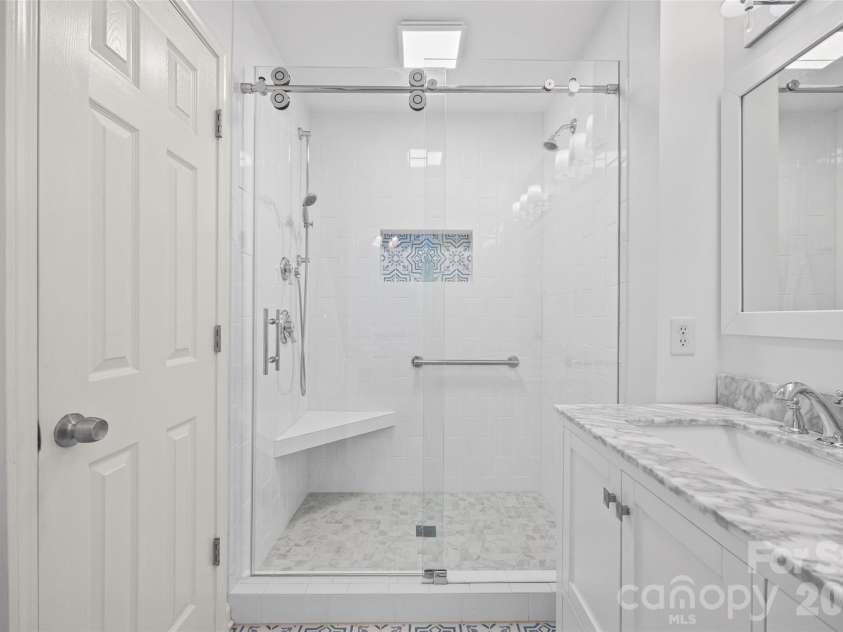 2139 Kaybird Lane, Charlotte, NC 28270.  MLS# CAR4411622, YatesRealty ID 45906. White tile shower with frameless glass