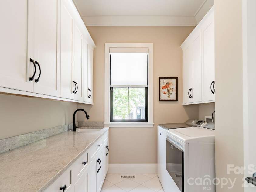 1725 Turtlewood Drive, Waxhaw, NC 28173.  MLS# CAR4407986, YatesRealty ID 45919. Laundry with Storage